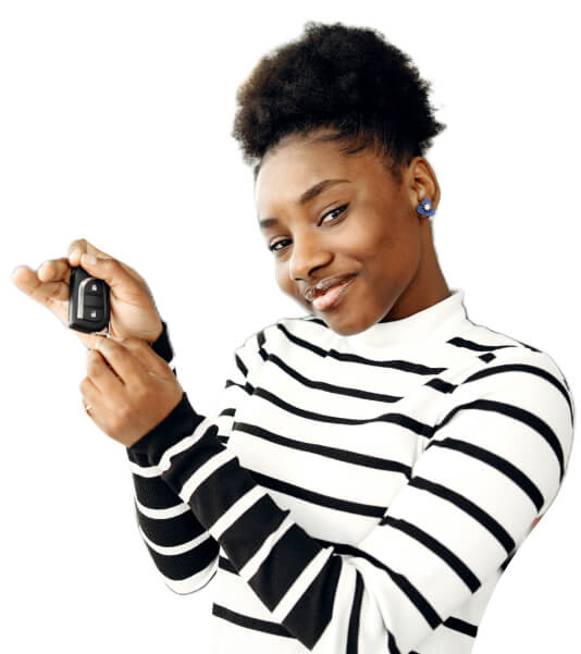 A smiling woman with car keys in her hand